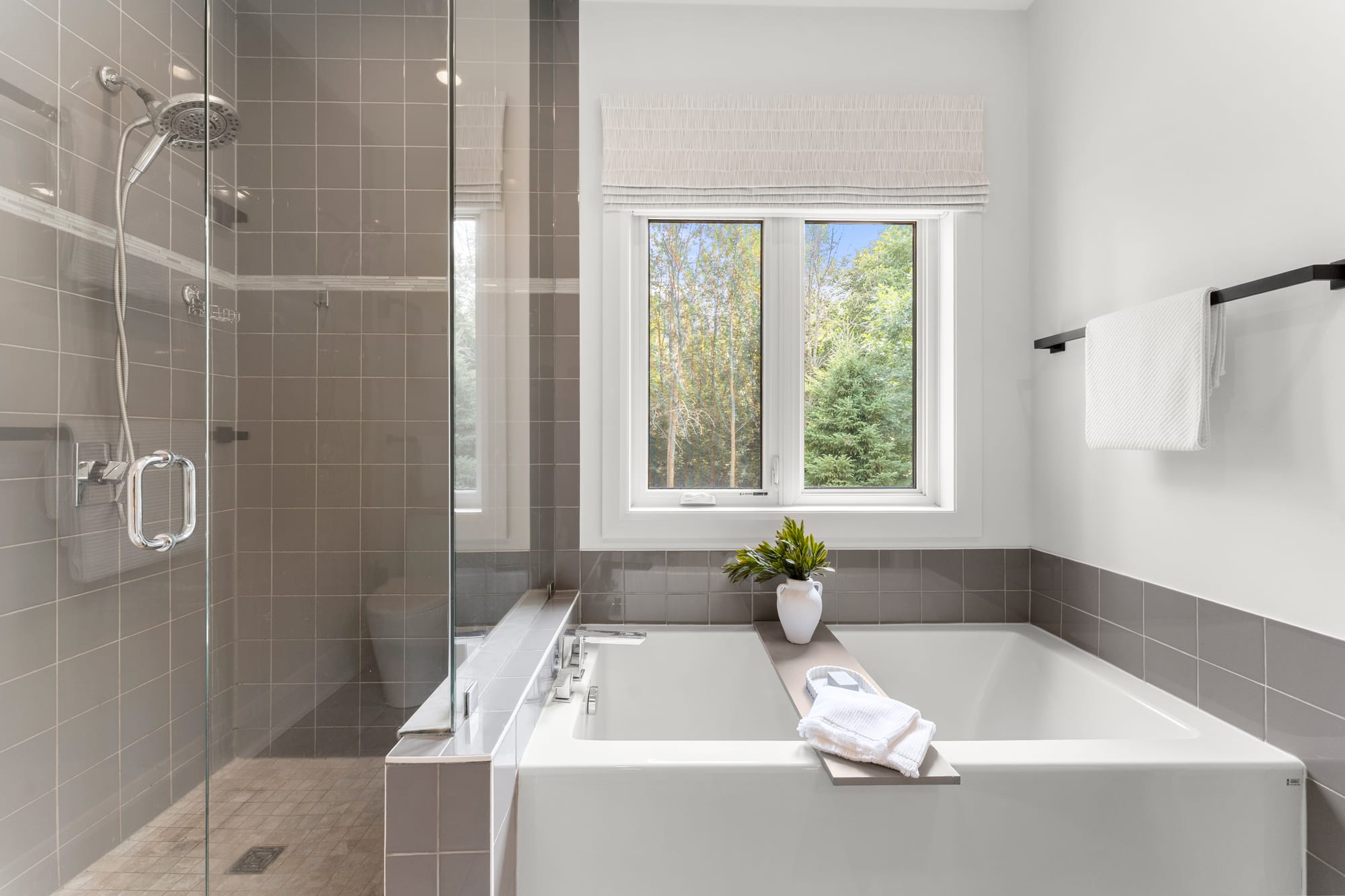 Ensuite with a deep soaker tub under a treed window and a glass walk-in shower, 110 Mary Street, Collingwood