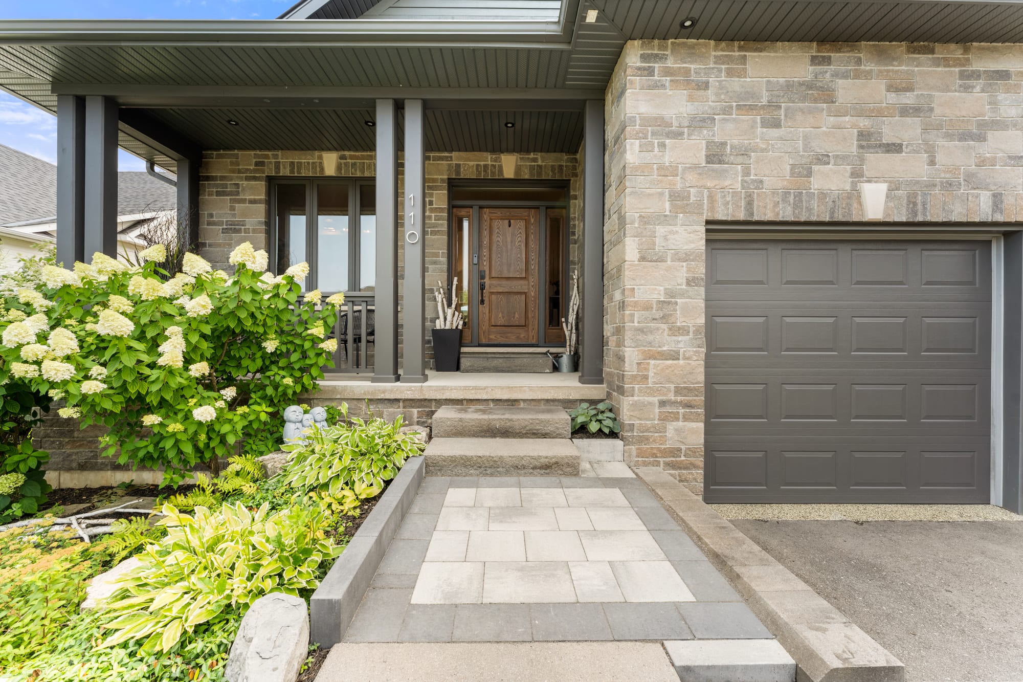 Paver walkway leading to the wood front door and covered entry porch at 110 Mary Street, Collingwood